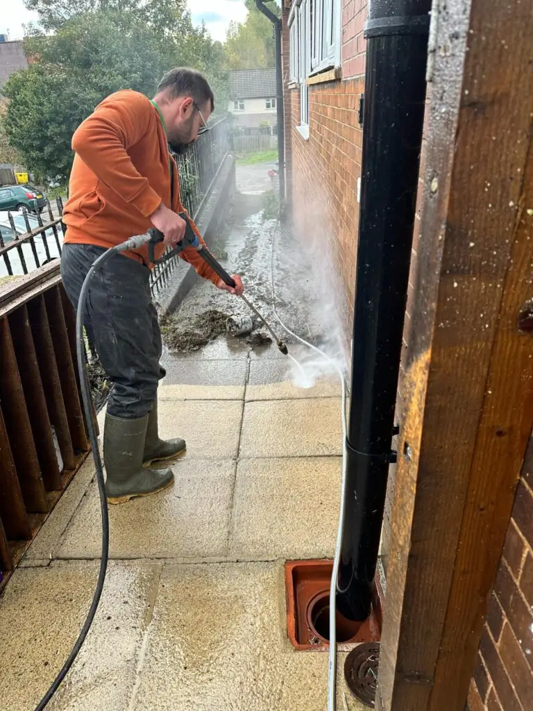 cleaning driveway after roof cleaning service