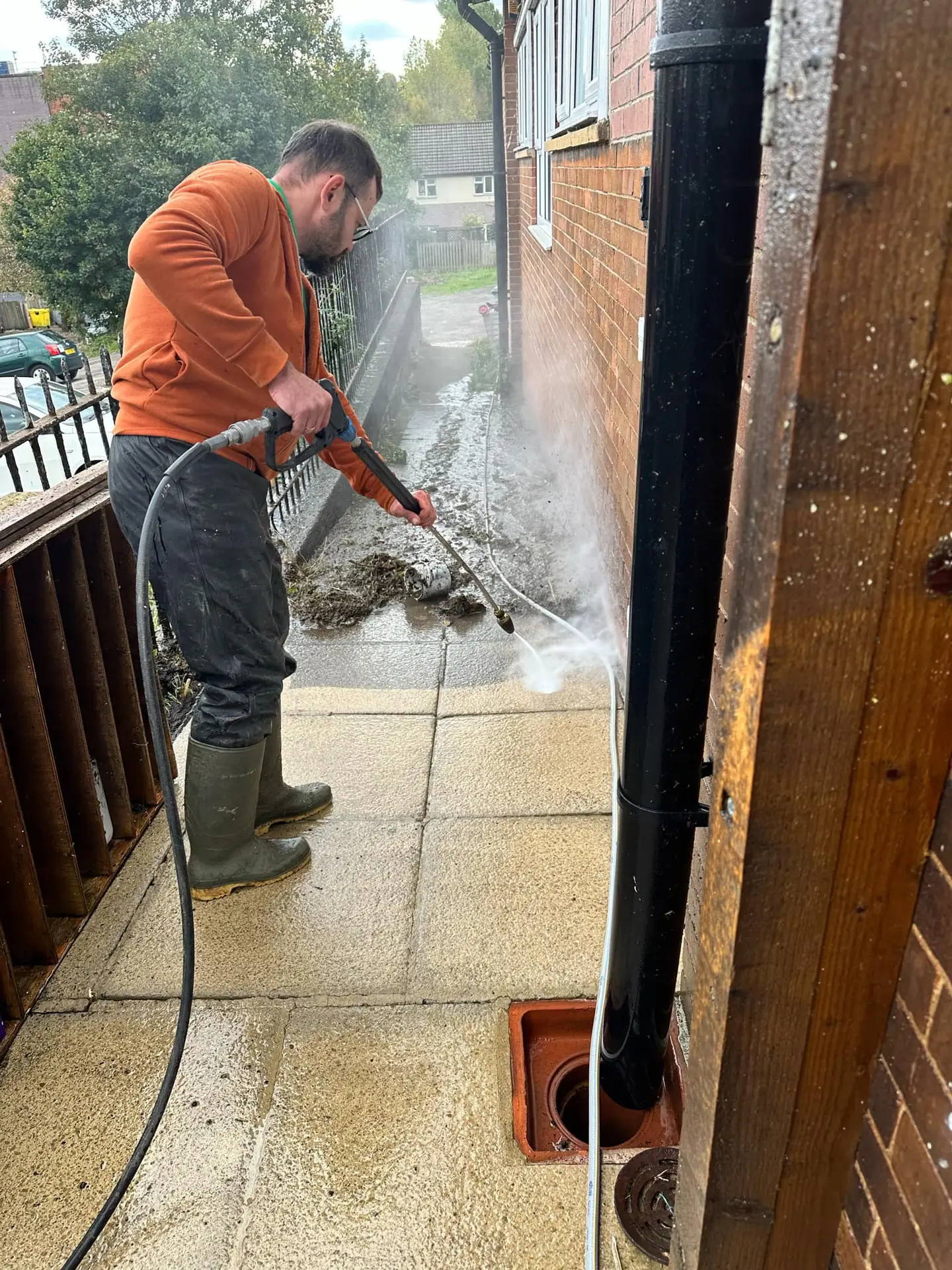 cleaning driveway after roof cleaning service